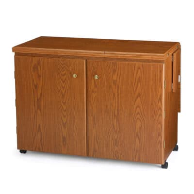 Oak Bertha Sewing Cabinet (700) from Arrow Sewing Furniture closed down to small footprint