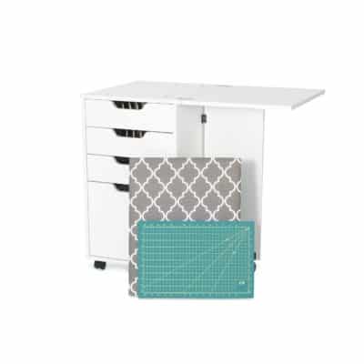The Kiwi Storage Cabinet offers additional storage for your sewing tools, a cutting mat, ironing board and thread organizer. Make the most out of the 4 dynamic storage drawers, including dedicated thread pegs and a deep bottom drawer to store an iron!