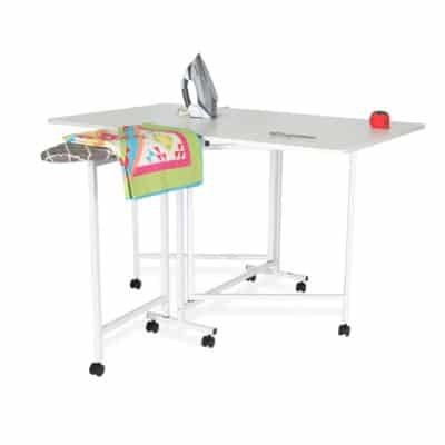 Millie Cutting & Ironing Table is a 2-in-1 cutting and ironing workstation! Millie features an expansive 59-1/8” x 35-7/8” cutting area, a built-in folding ironing station, and heavy-duty casters for easy mobility in your sewing area.