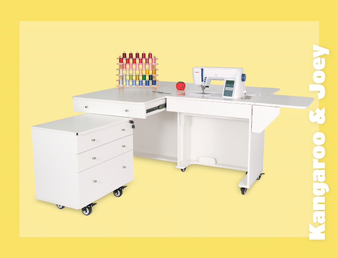 Kangaroo & Joey is a signature full-size sewing cabinet by Kangaroo Sewing Furniture featuring a 3-position hydraulic lift, an expansive worksurface for large quilting projects, and a rolling storage caddy.